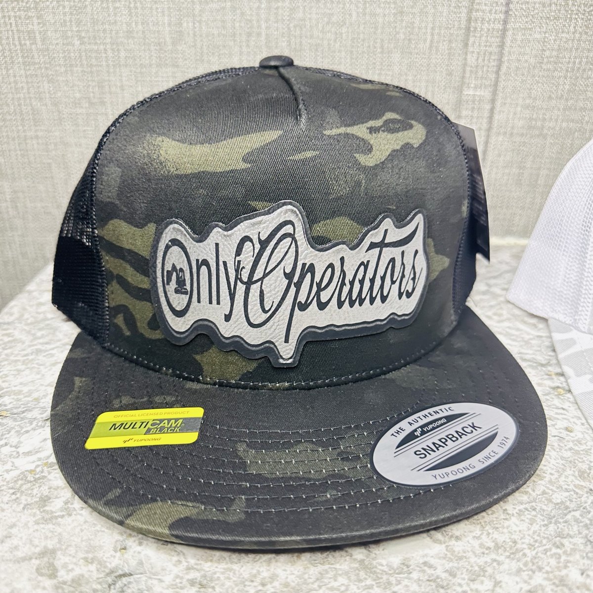 Multicam black Yupoong snapback with a gray Only Operators patch, by KB Custom Creations