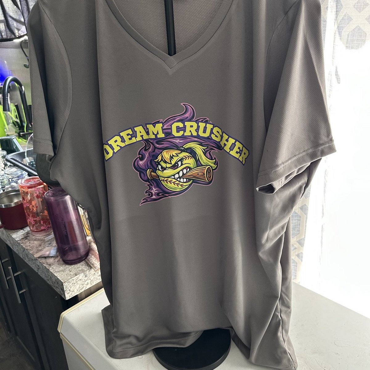 Gray softball jersey with a Dream Crusher team logo on the front, made by KB Custom Creations