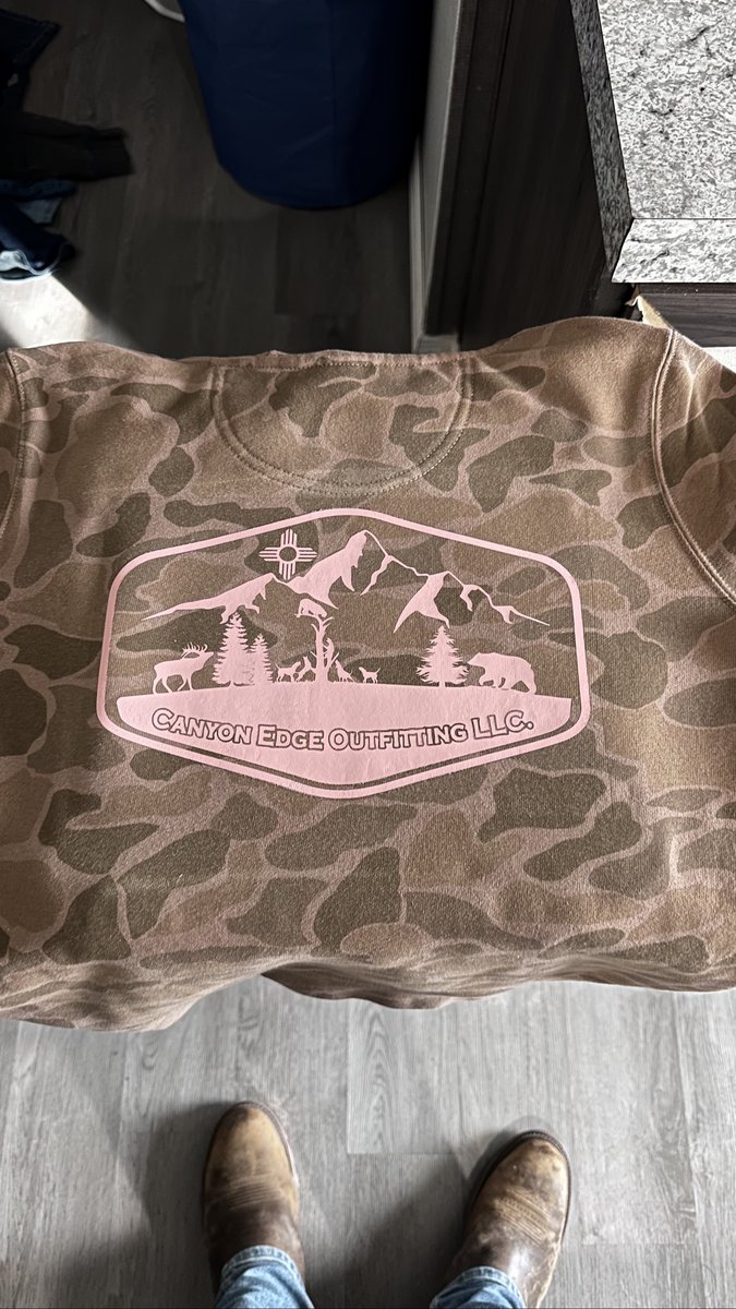 Camo sweatshirt with a large pink Canyon Edge Outfitting LLC logo on the back, by KB Custom Creations