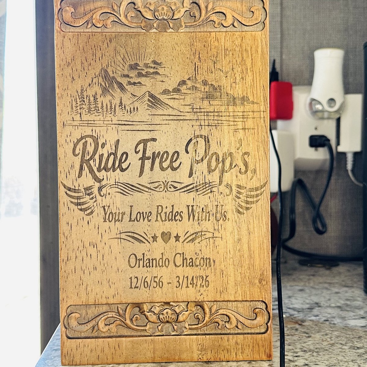 Engraved wood memorial plaque with a mountain scene and carved borders, by KB Custom Creations