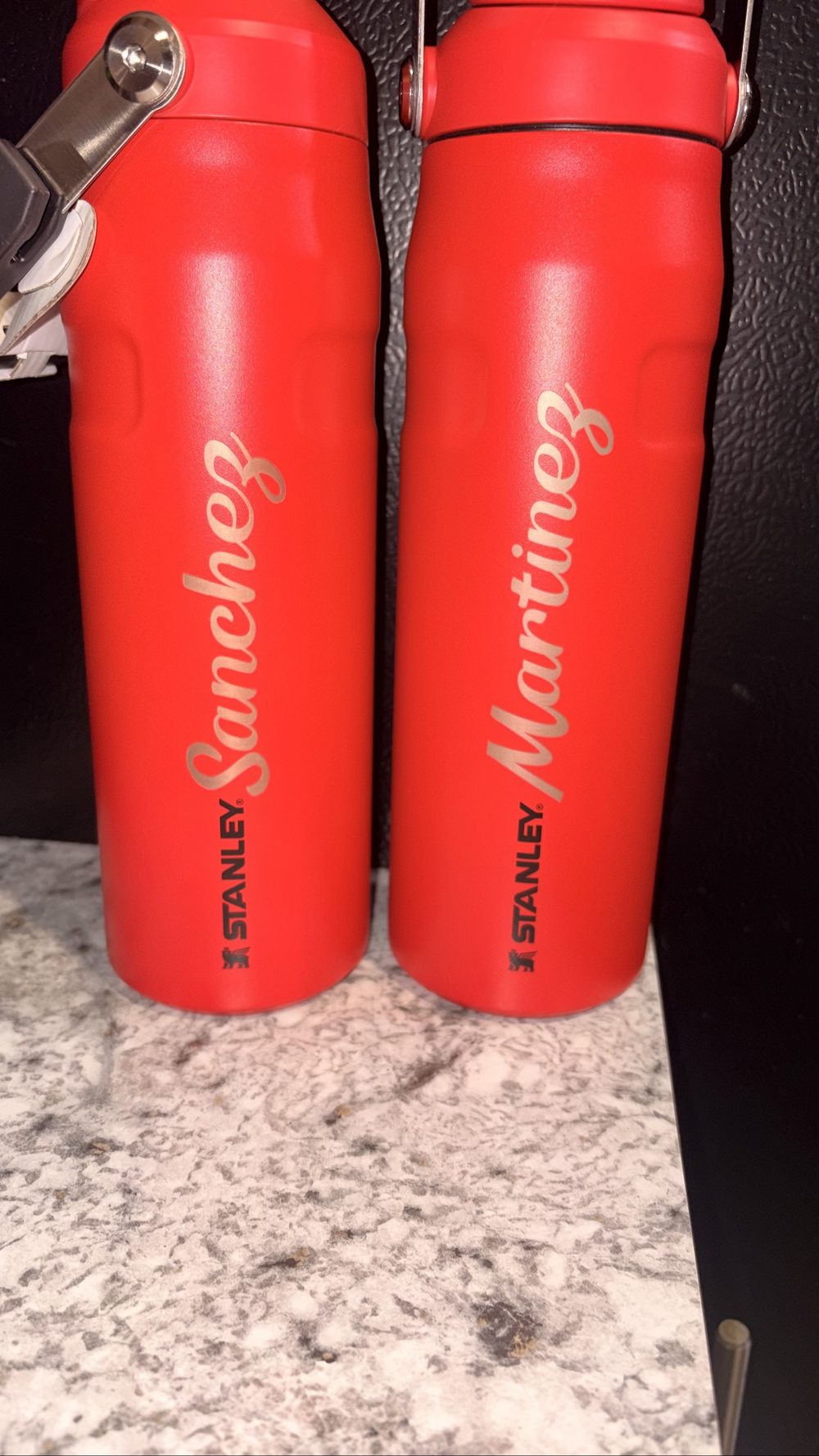 Red bottles engraved with names by KB Custom Creations