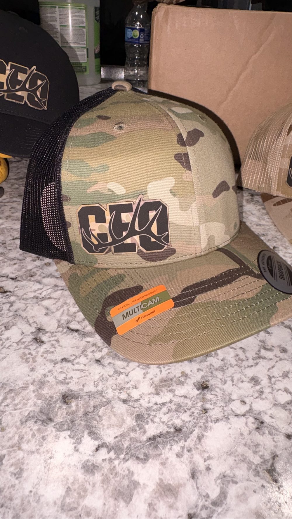 Camo trucker hat with custom logo by KB Custom Creations